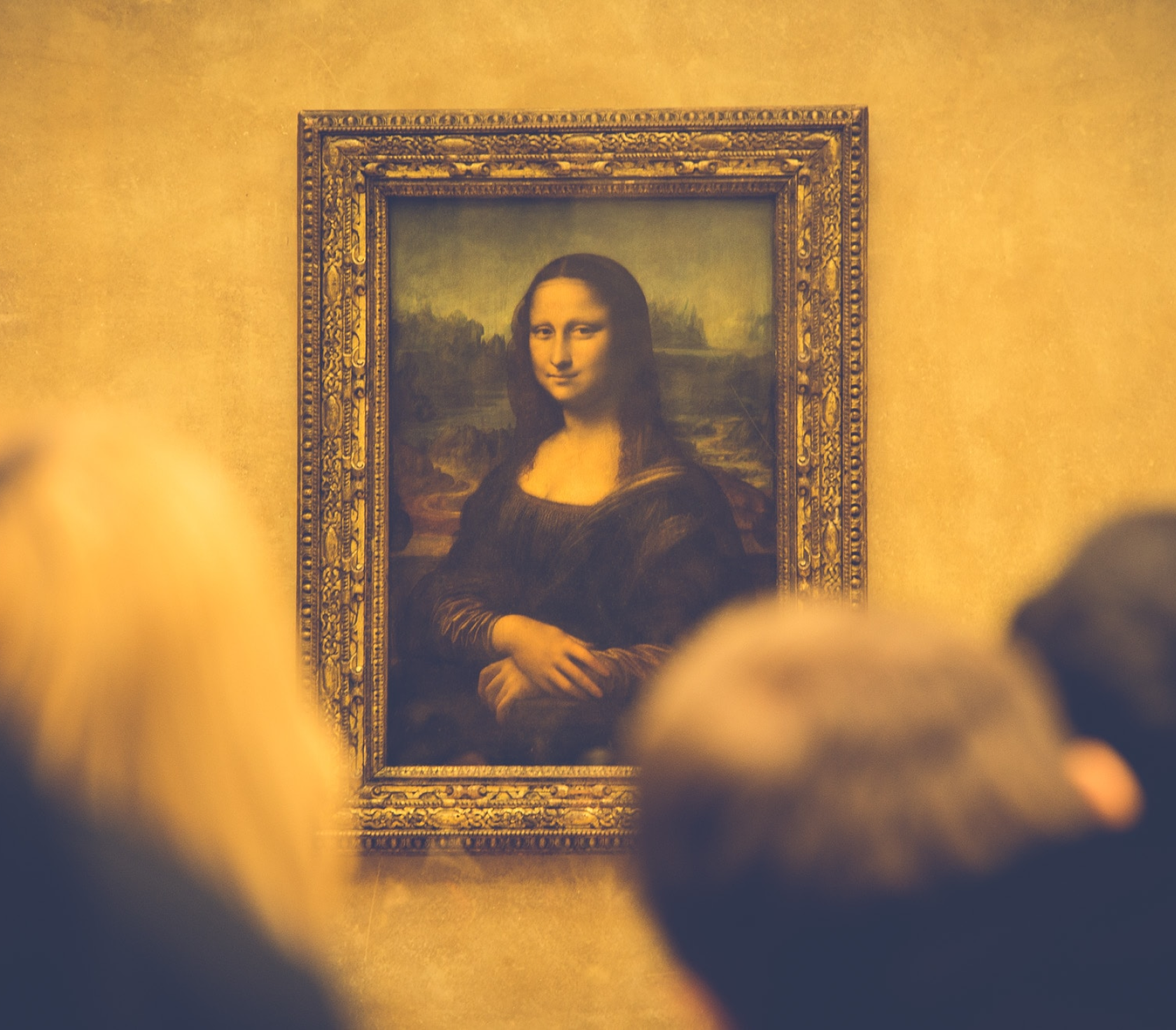 Visitors viewing the Mona Lisa at the Louvre museum