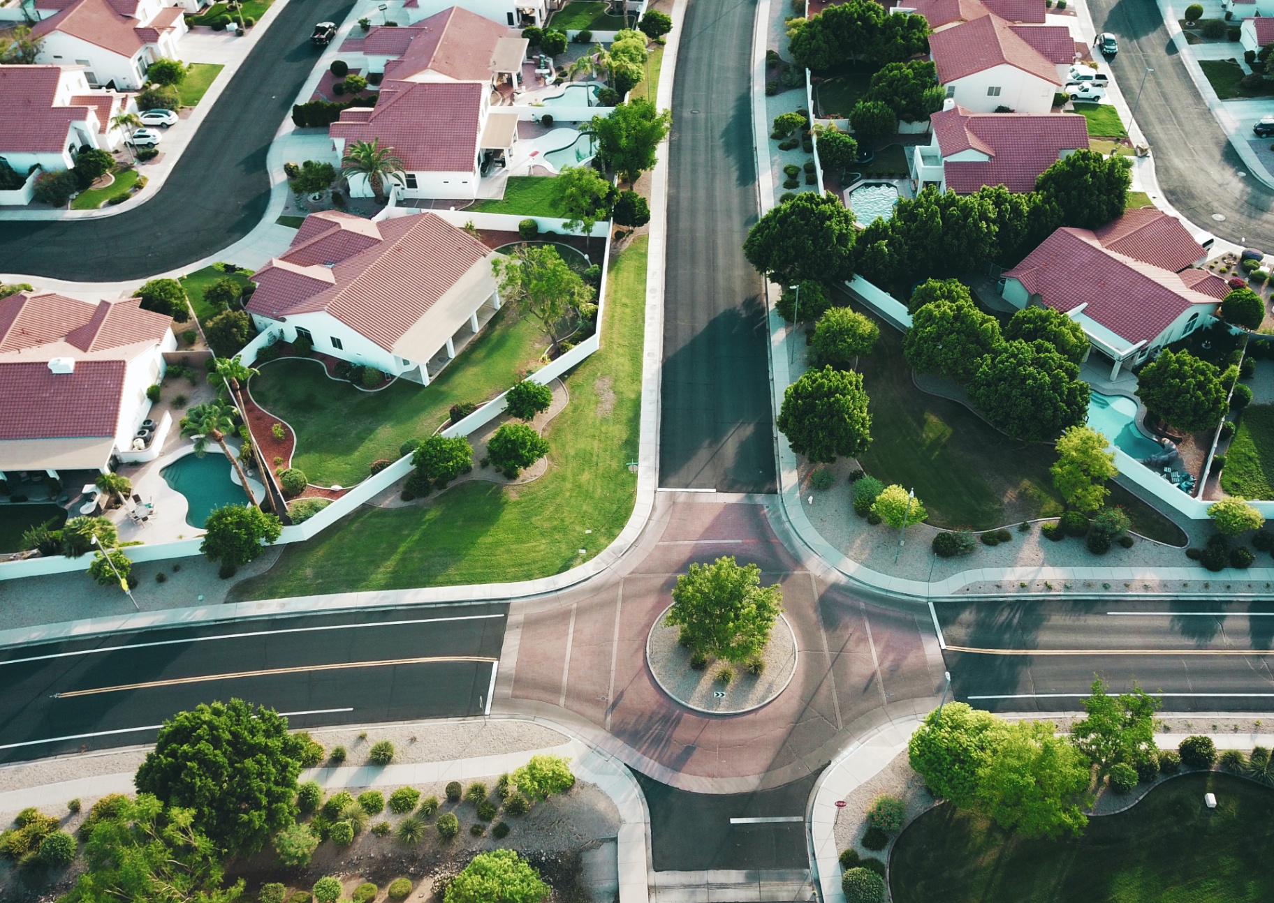 Aerial view of a residential neighbourhood with tree-lined streets and cul-de-sacs